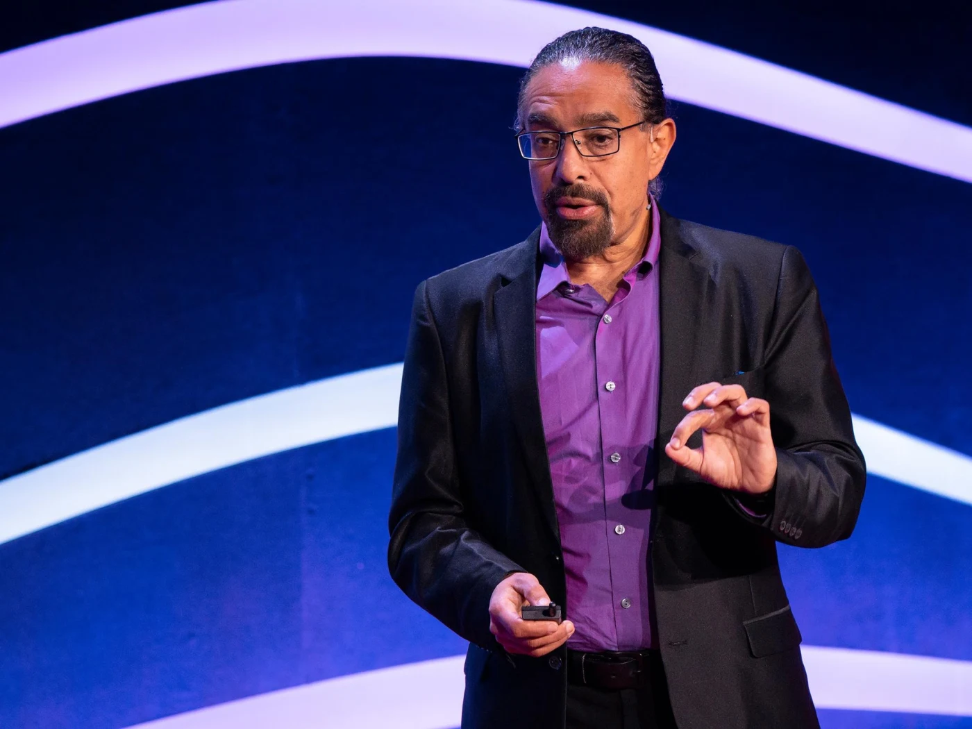 Ramez Naam speaking on stage at TED Countdown